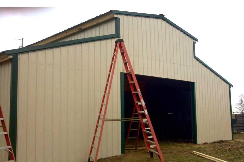 Photo of covered outdoor storage area large enough to store 2 tractors or other farm equipment and suppies