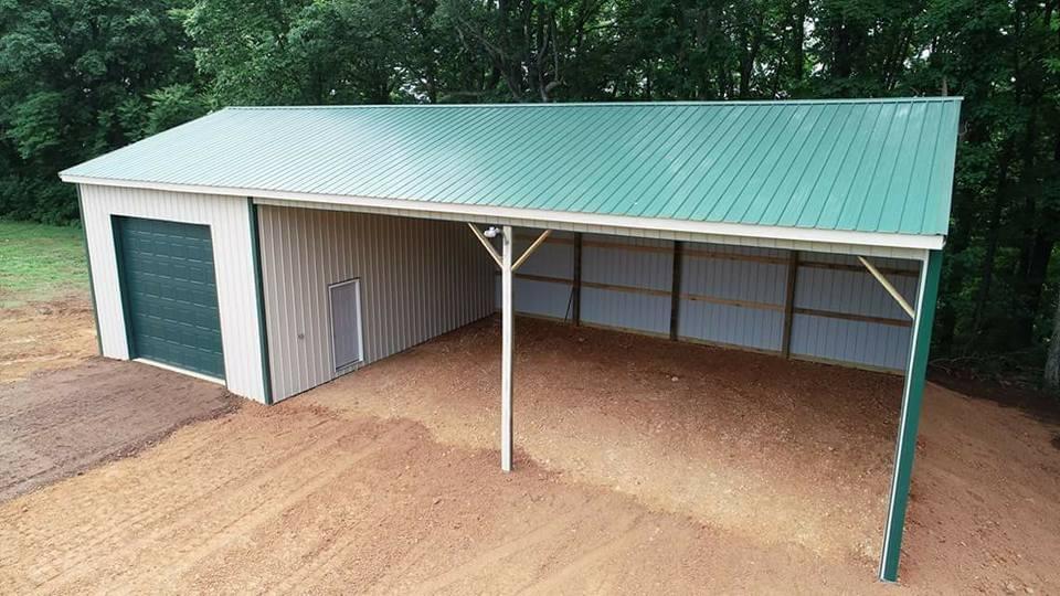 Photo of metal gate with metal electric fence framed with wood posts and rails