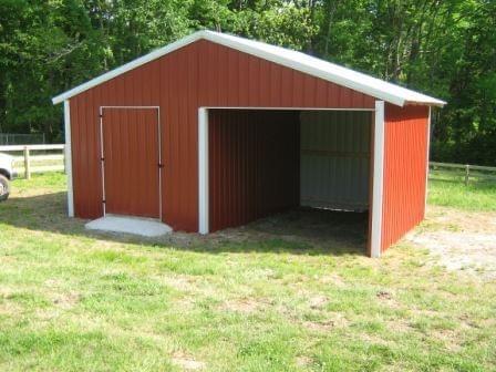 Photo of metal gate with metal electric fence framed with wood posts and rails