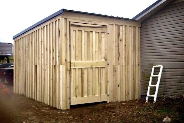 Photo of covered outdoor storage area large enough to store 2 tractors or other farm equipment and suppies