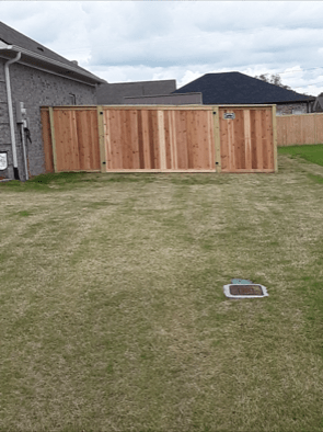 Photo of backyard privacy fence in a subdivision backyard.